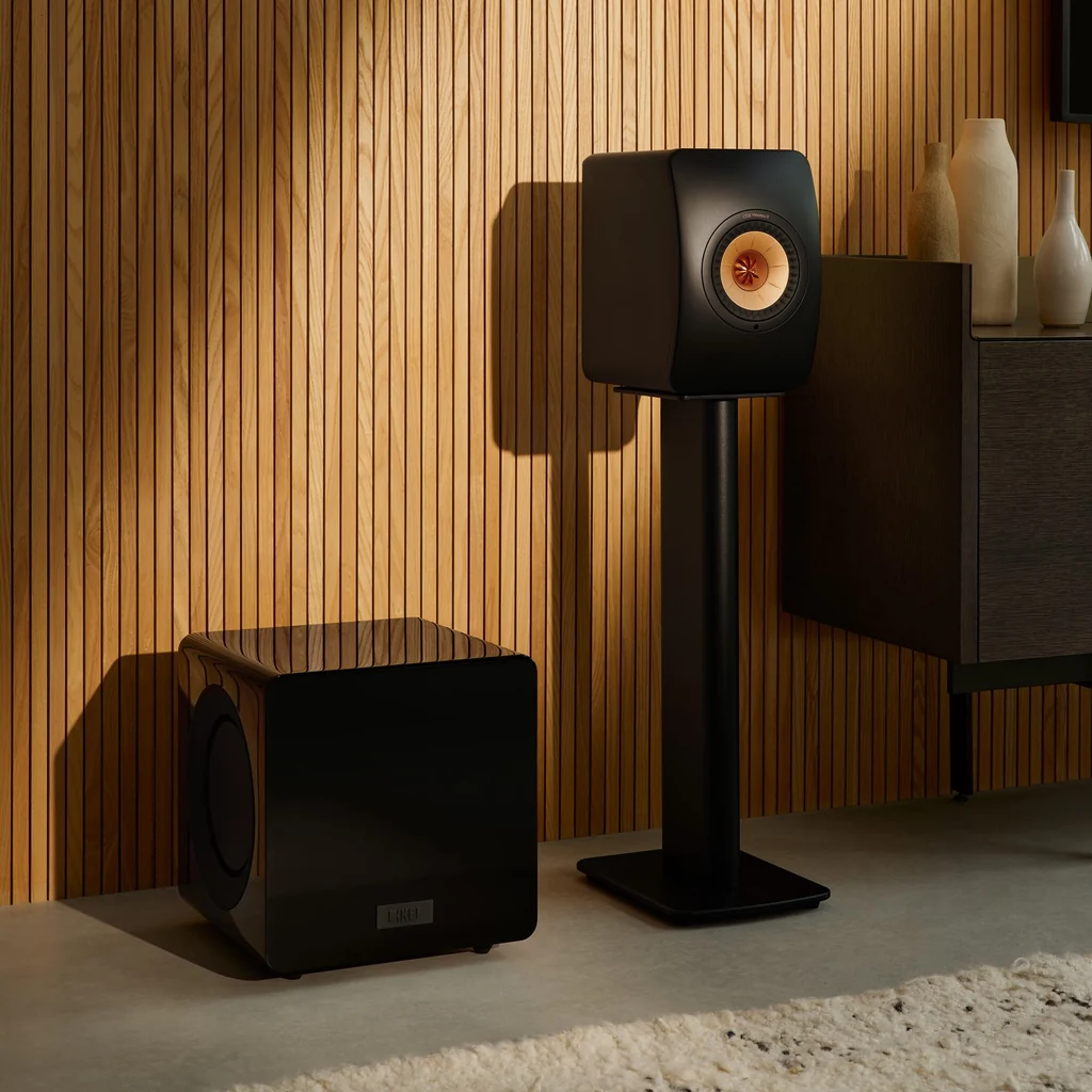 KEF KC92 Black subwoofer placed in a home theatre setup