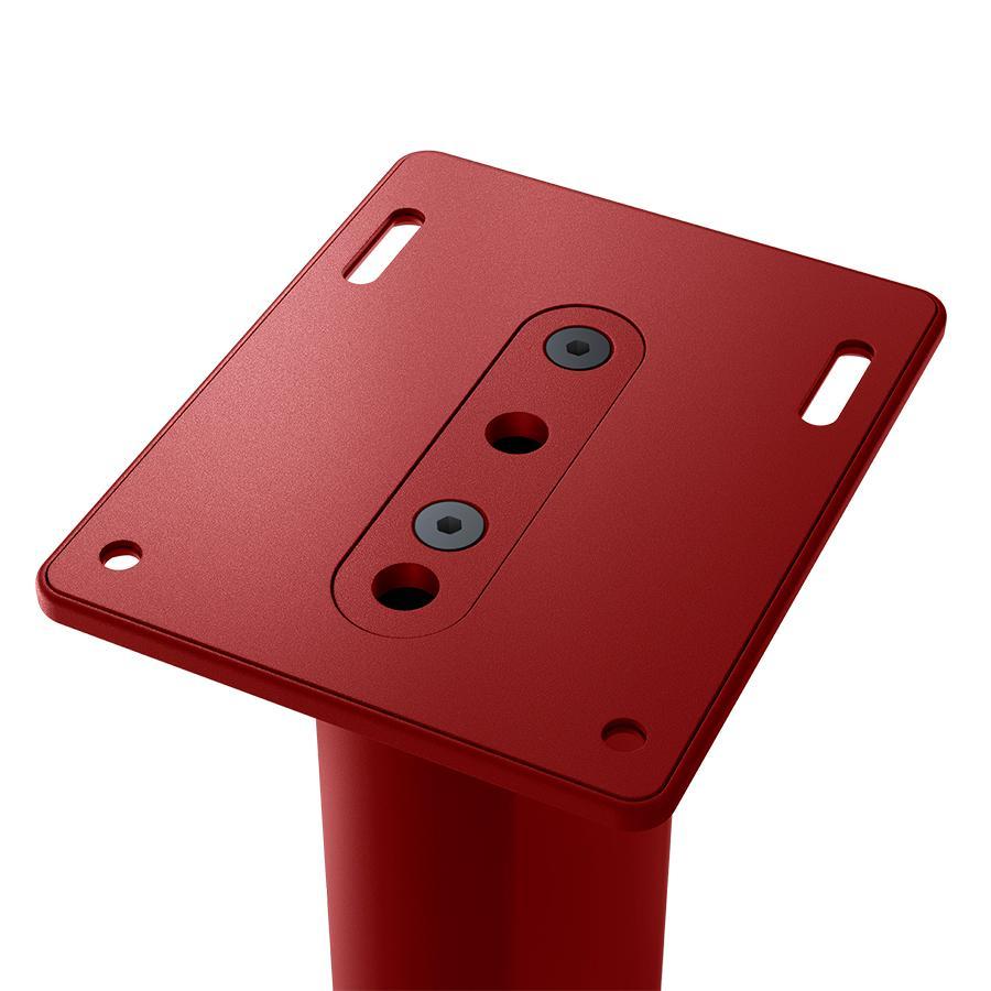 Close-up of KEF S2 Floor Stand base plate and spike discs in Crimson Red